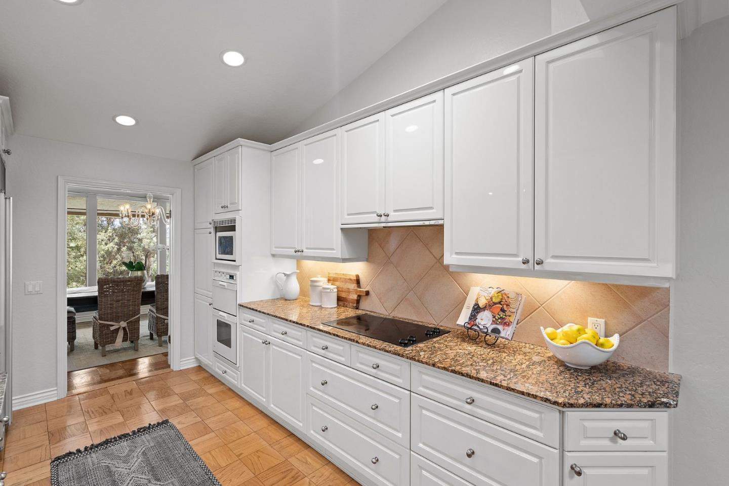 300 Sand Hill Circle, Unit 303 Menlo Park, CA 94025 - Photo 9 of 33 a kitchen with granite countertop a sink and cabinets