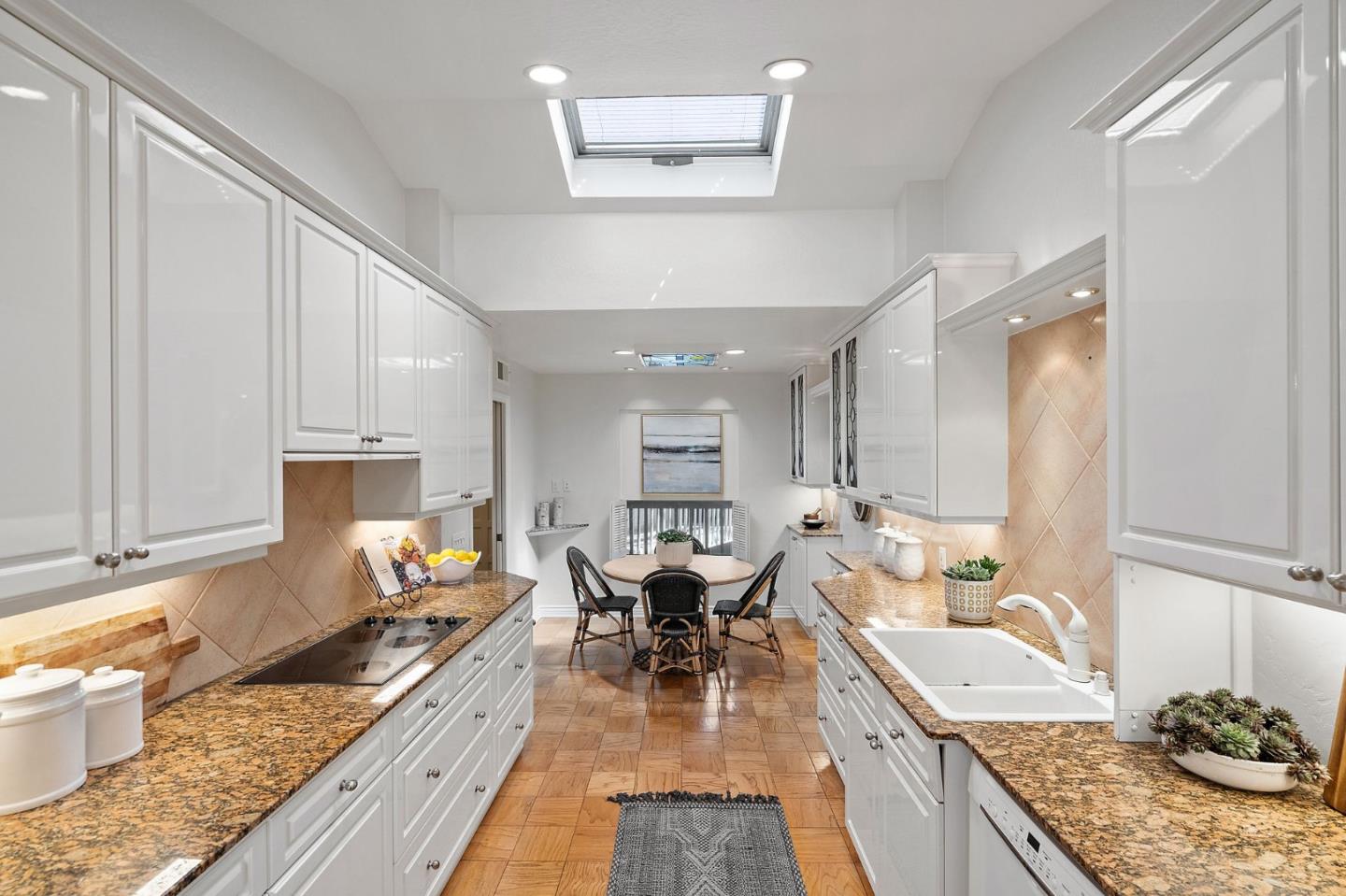 300 Sand Hill Circle, Unit 303 Menlo Park, CA 94025 - Photo 10 of 33 a kitchen with granite countertop lots of counter top space and furniture