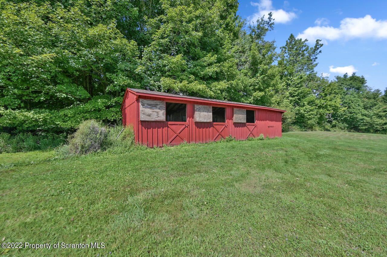 73 Forks Bridge Road Newfoundland, PA 18445 - Photo 3 of 55 a front view of a house with yard and swimming pool