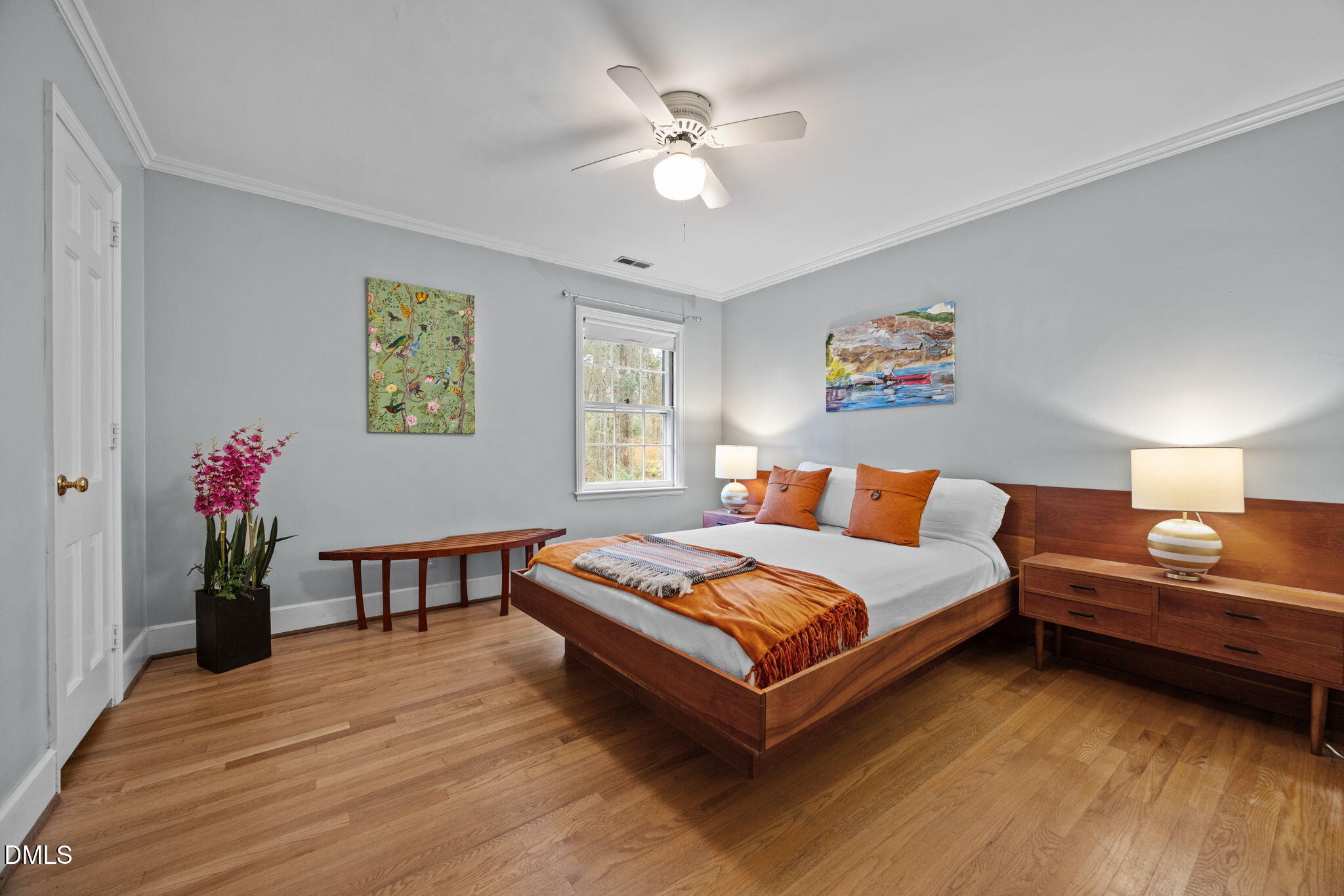 1121 Anderson Street Durham, NC 27705 - Photo 25 of 59 a bedroom with a bed and a chandelier