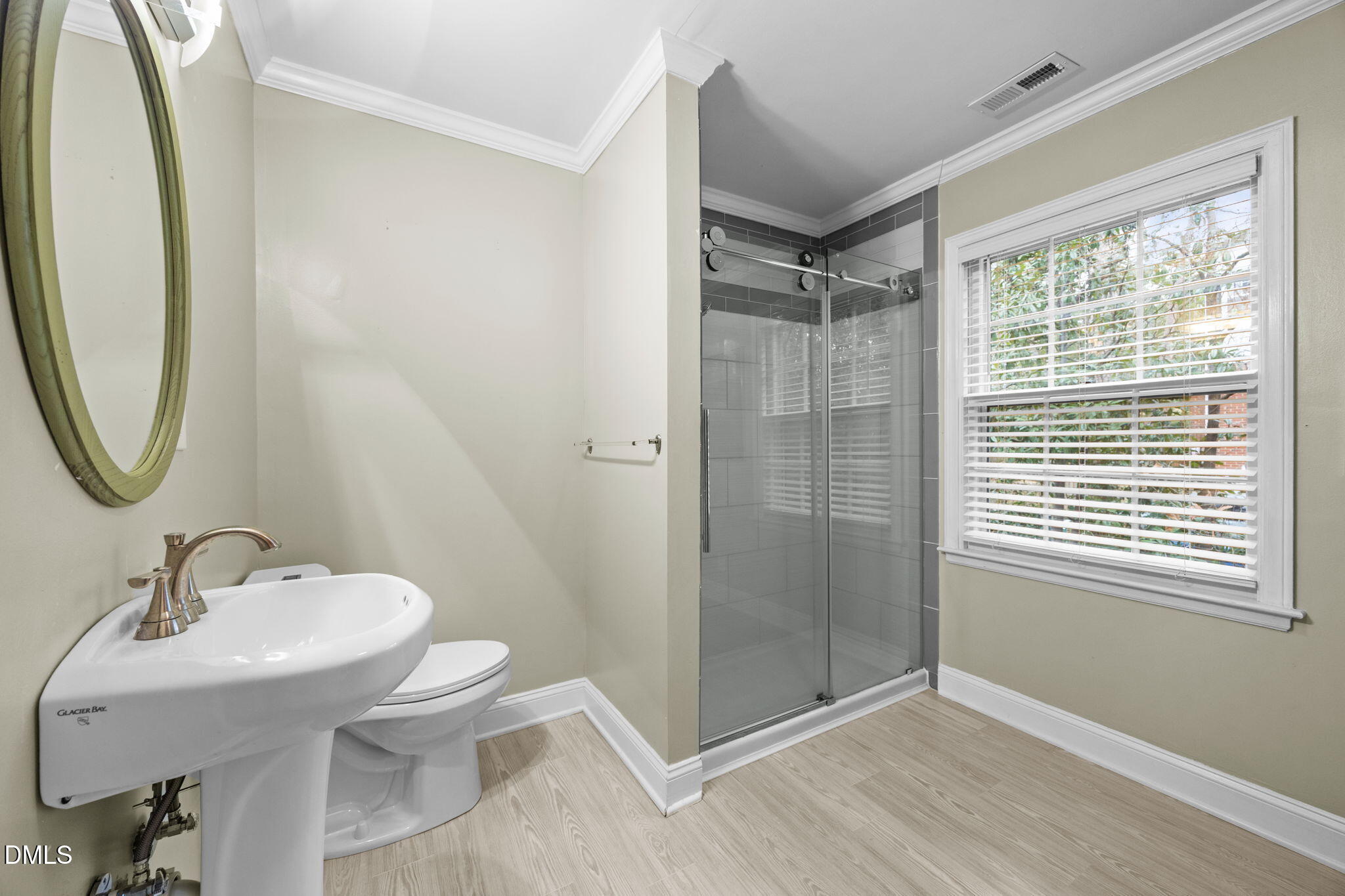 1121 Anderson Street Durham, NC 27705 - Photo 26 of 59 a bathroom with a sink toilet and shower