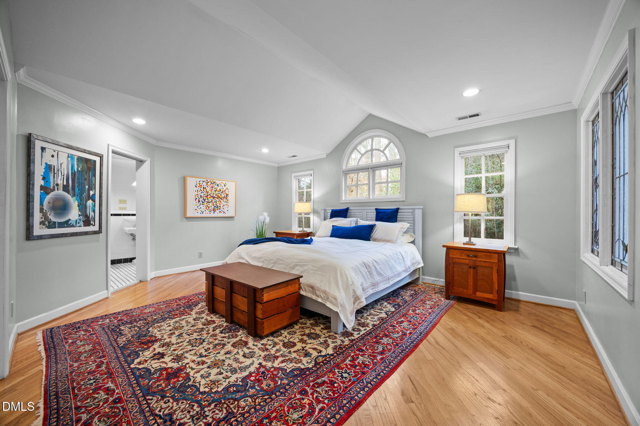 1121 Anderson Street Durham, NC 27705 - Photo 30 of 59 a spacious bedroom with a large bed and a window