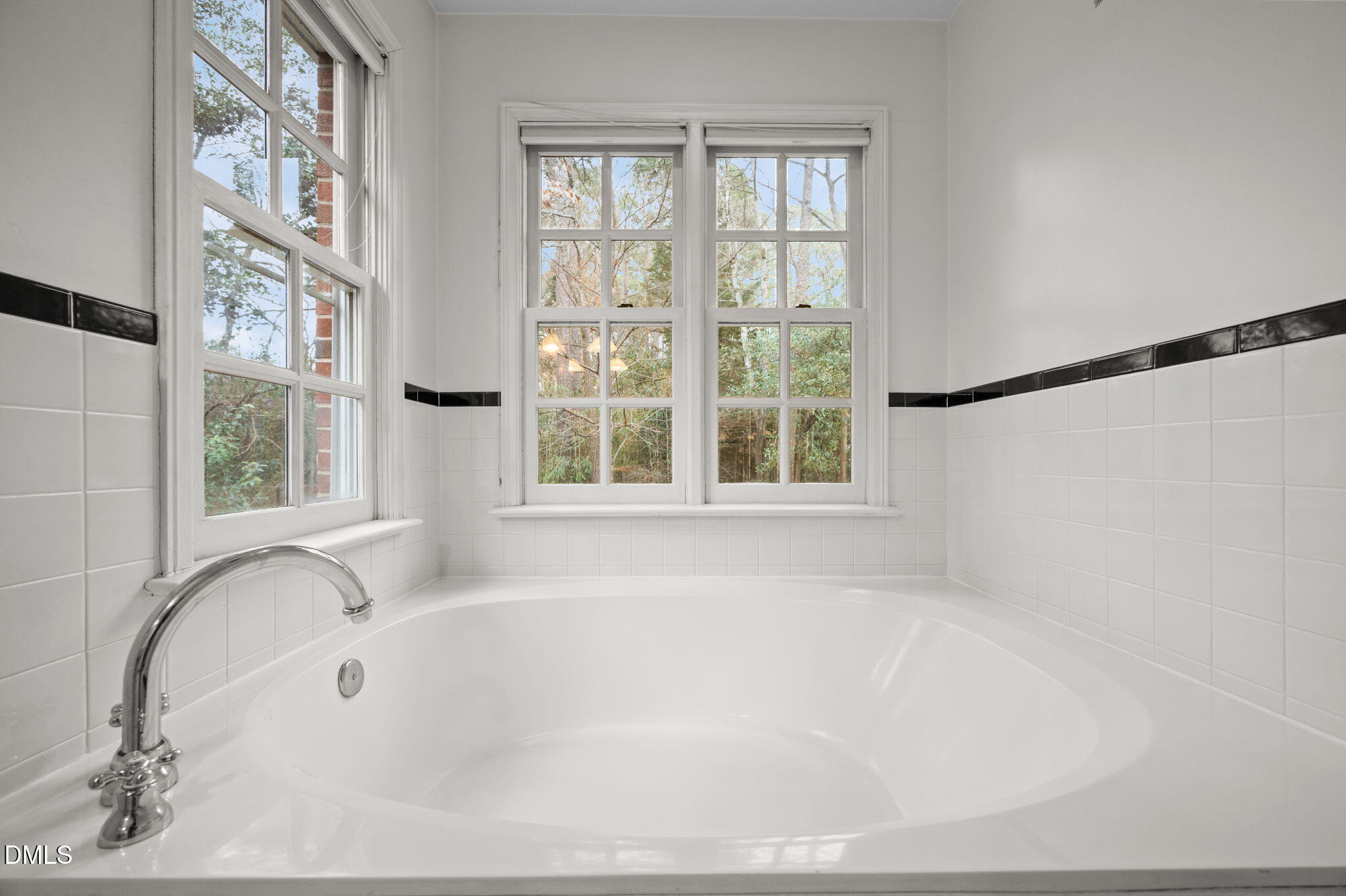 1121 Anderson Street Durham, NC 27705 - Photo 33 of 59 a white bath tub sitting next to a window