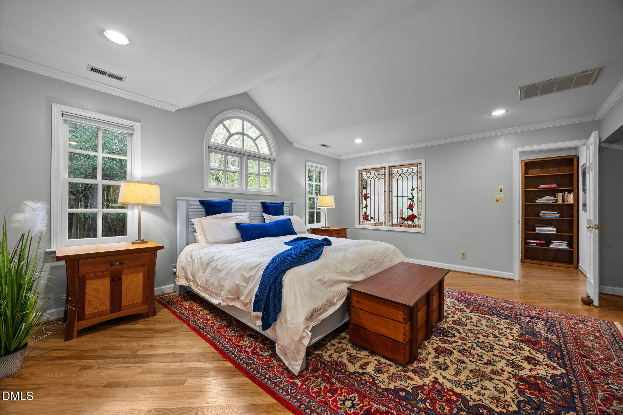 1121 Anderson Street Durham, NC 27705 - Photo 35 of 59 a spacious bedroom with a large bed and a window