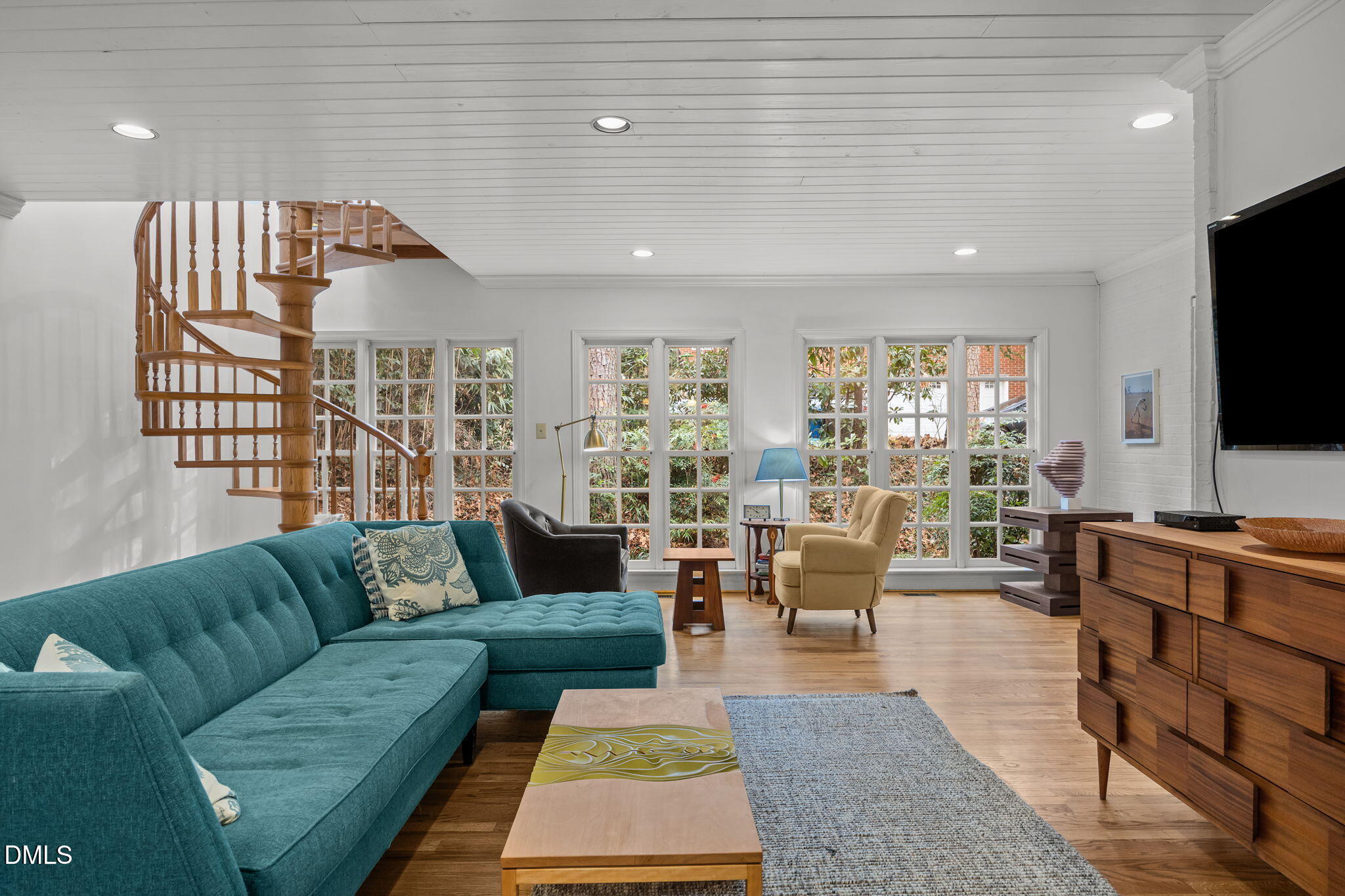 1121 Anderson Street Durham, NC 27705 - Photo 38 of 59 a living room with furniture and a flat screen tv