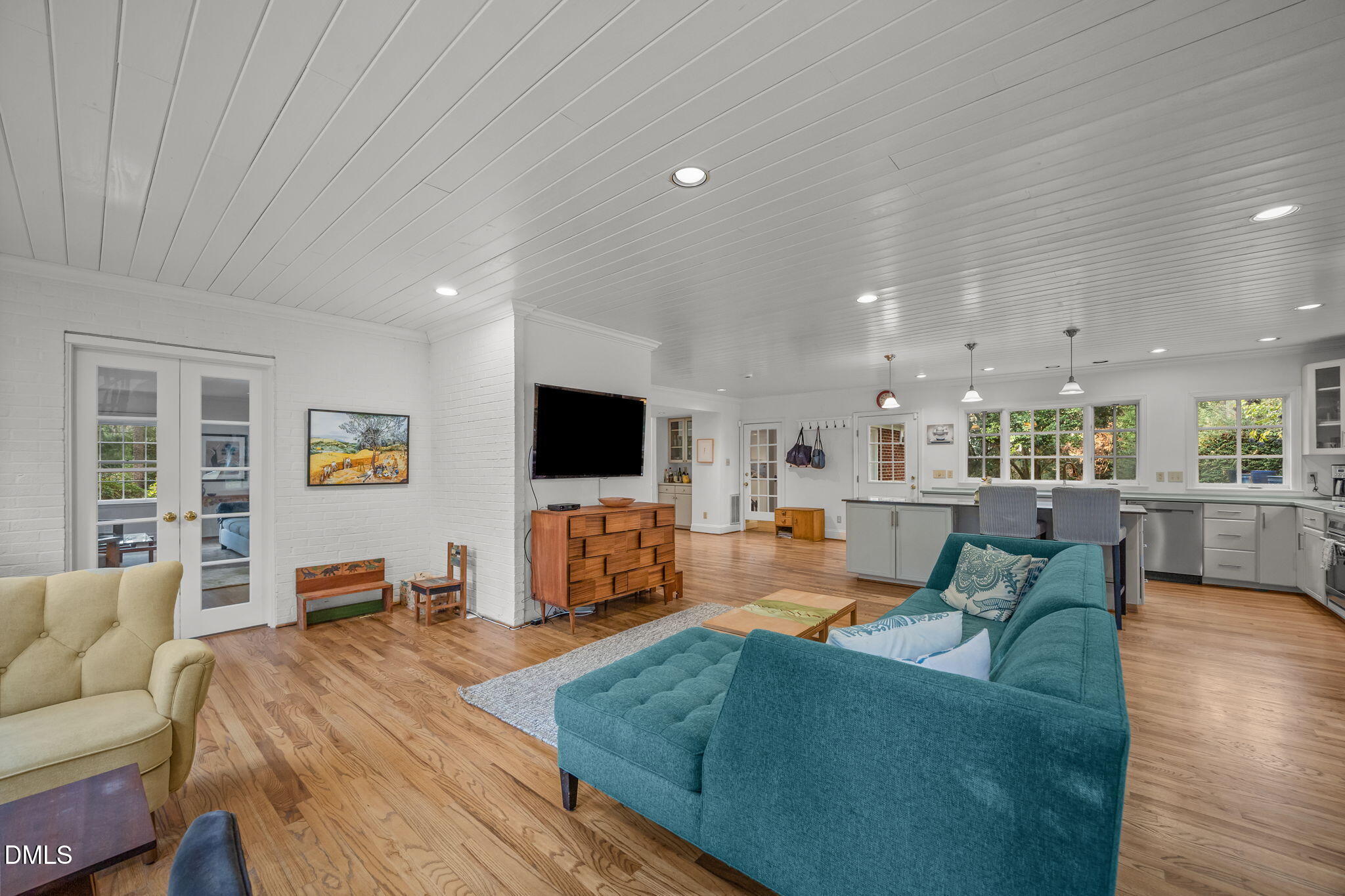 1121 Anderson Street Durham, NC 27705 - Photo 40 of 59 a living room with furniture and a flat screen tv