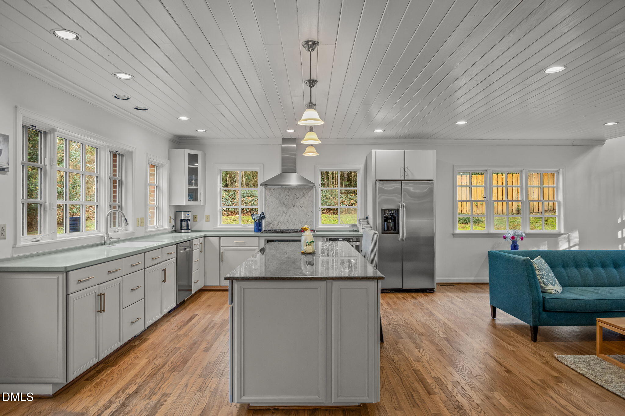 1121 Anderson Street Durham, NC 27705 - Photo 46 of 59 a large kitchen with granite countertop a large island in the center windows and furniture