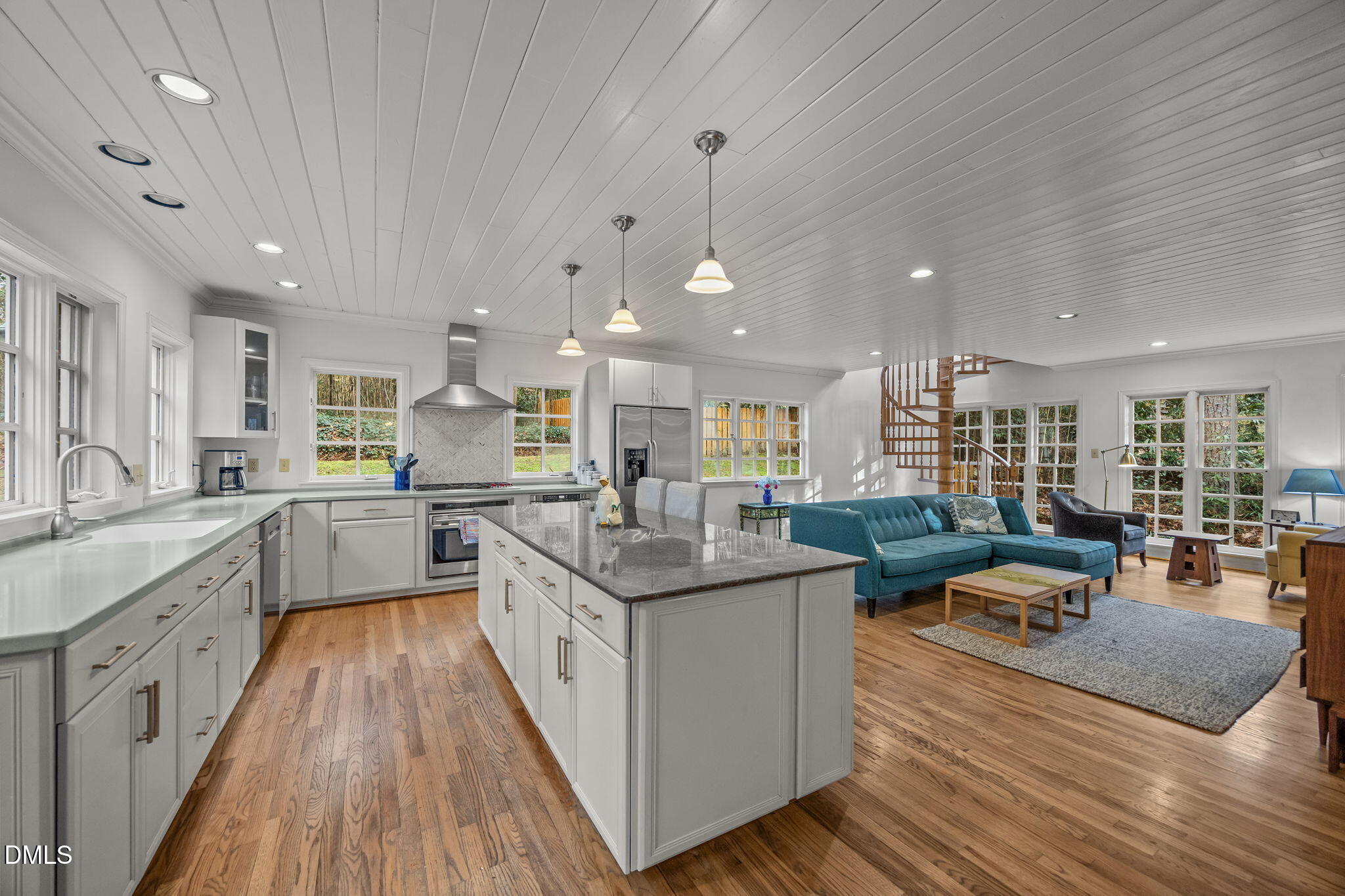 1121 Anderson Street Durham, NC 27705 - Photo 47 of 59 a large kitchen with lots of counter top space a sink a window and stainless steel appliances