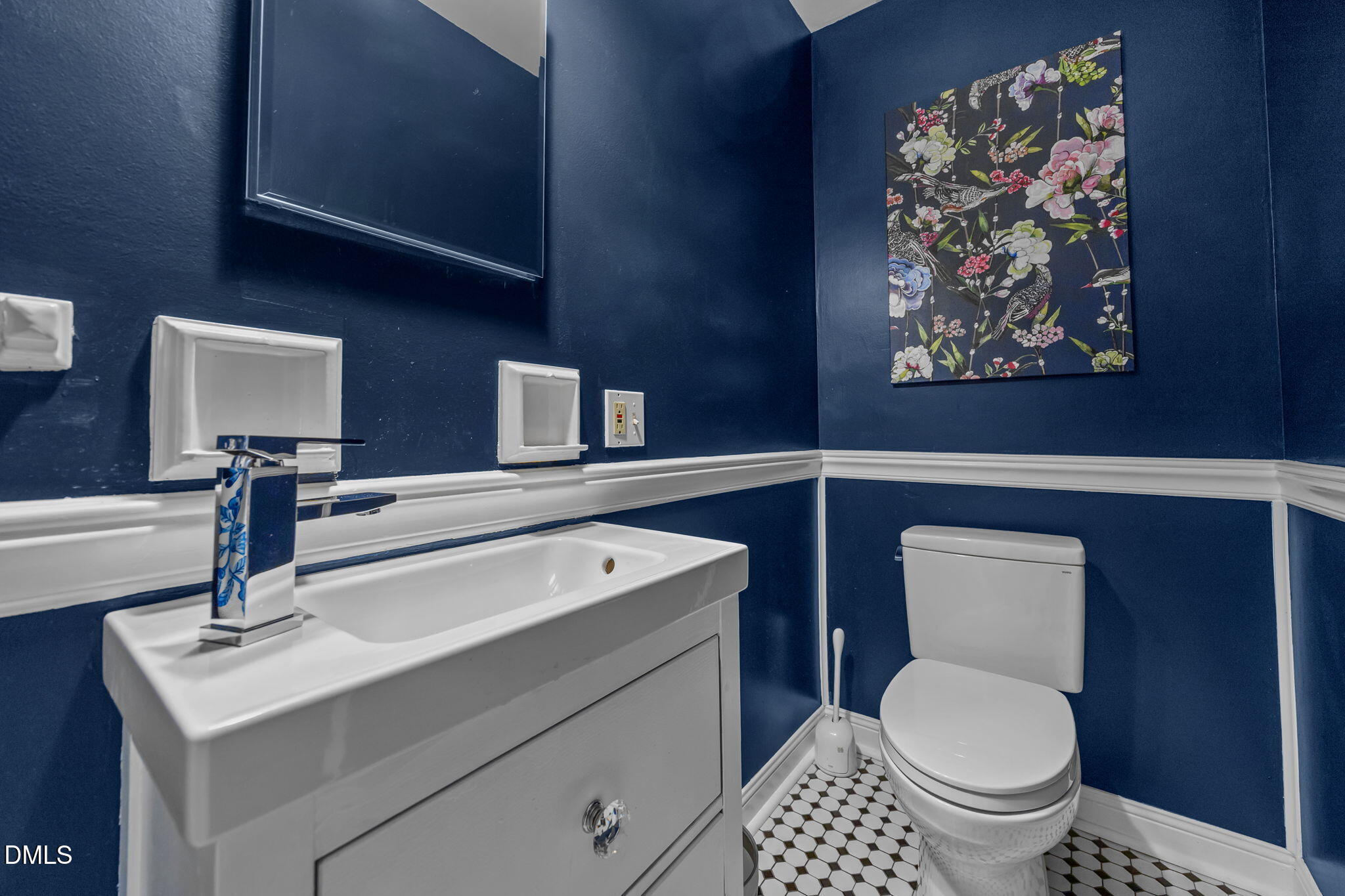 1121 Anderson Street Durham, NC 27705 - Photo 9 of 59 a bathroom with a toilet a sink and mirror