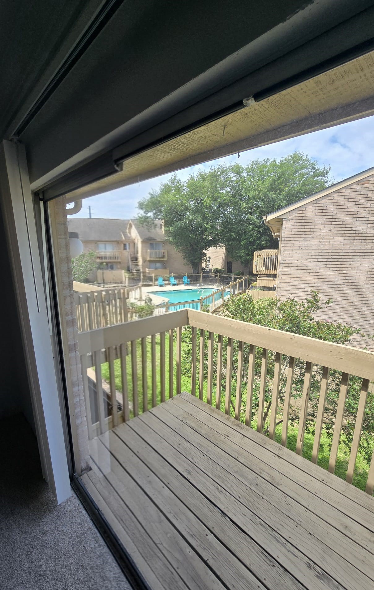 4747 Allendale Road, Unit 50 Houston, TX 77017 - Photo 5 of 9 a balcony with wooden floor