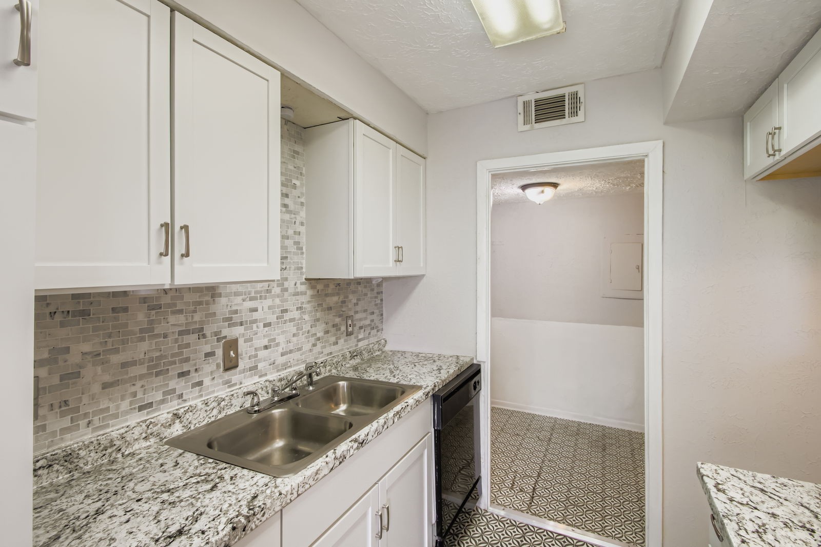810 Bellevue Road, Unit 120 Nashville, TN 37221 - Photo 11 of 33 a kitchen with a sink stove and cabinets