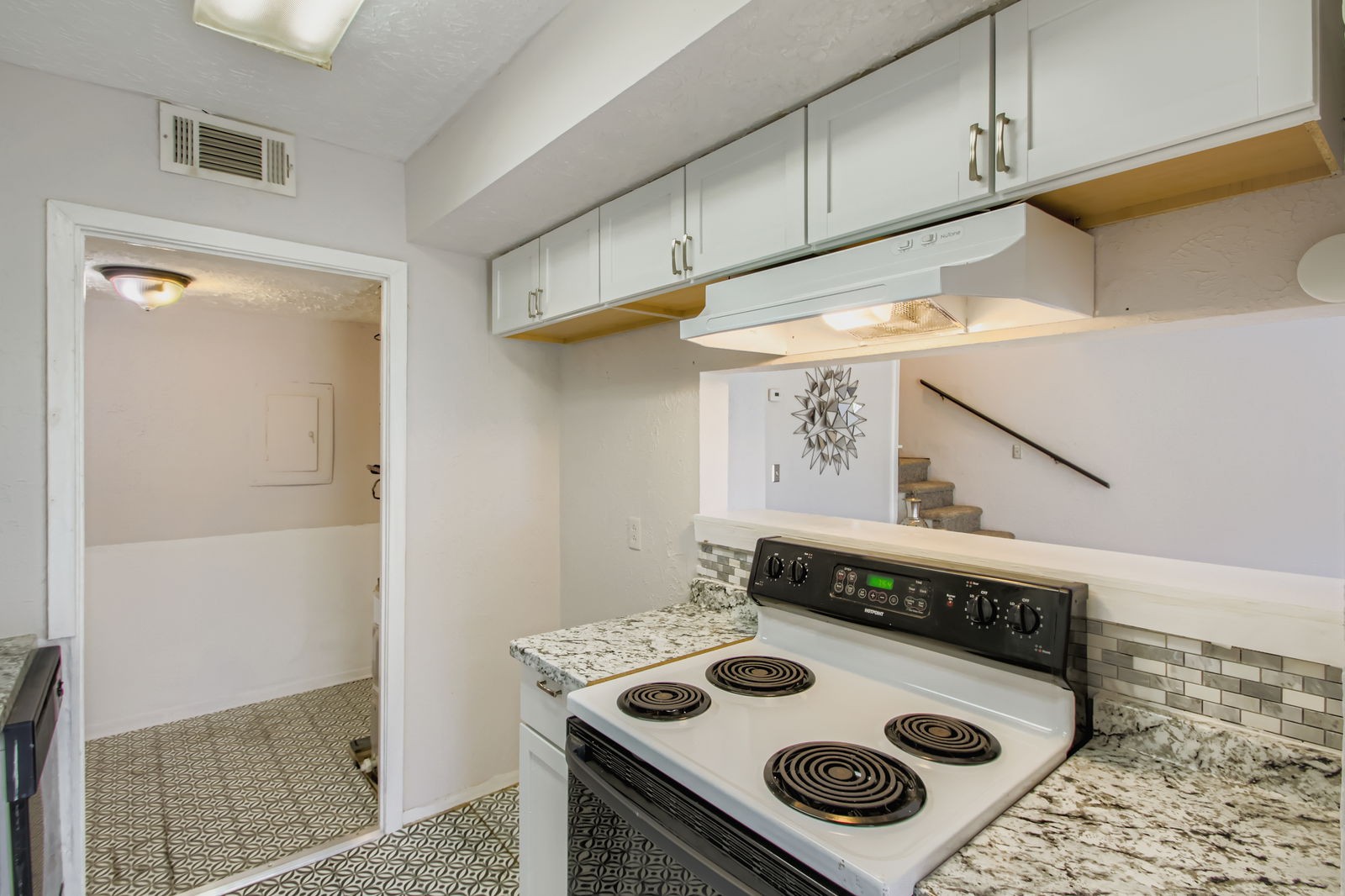 810 Bellevue Road, Unit 120 Nashville, TN 37221 - Photo 14 of 33 a kitchen with a stove and a table