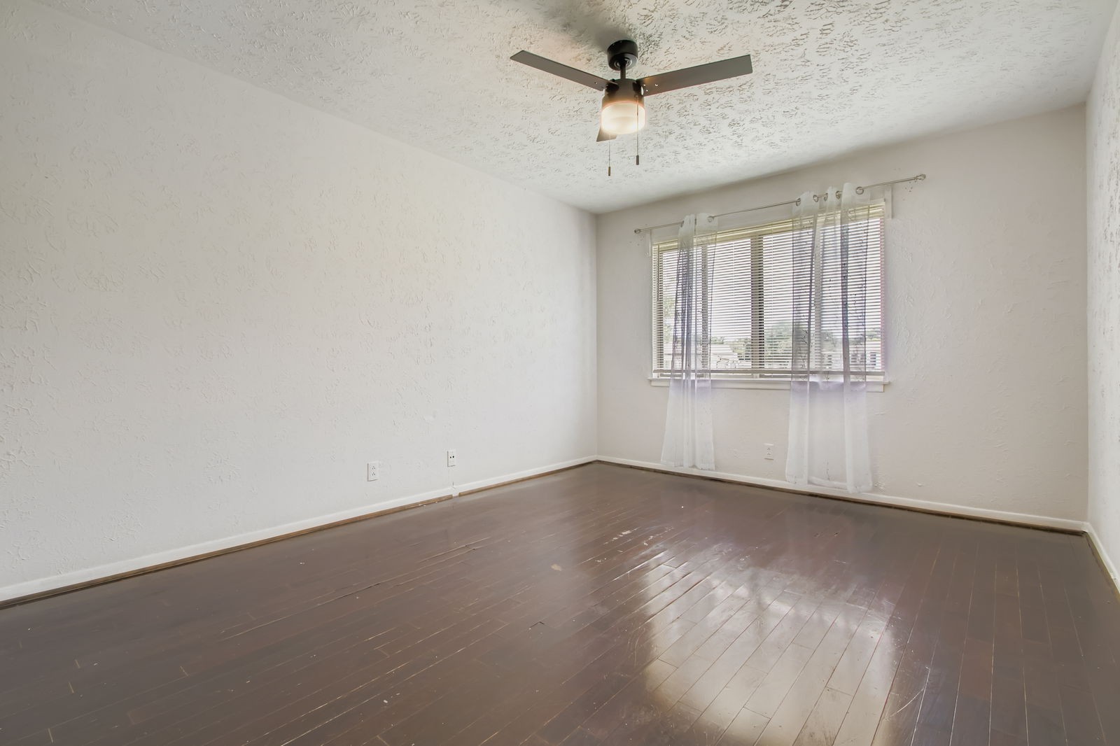 810 Bellevue Road, Unit 120 Nashville, TN 37221 - Photo 16 of 33 an empty room with wooden floor ceiling fan and windows