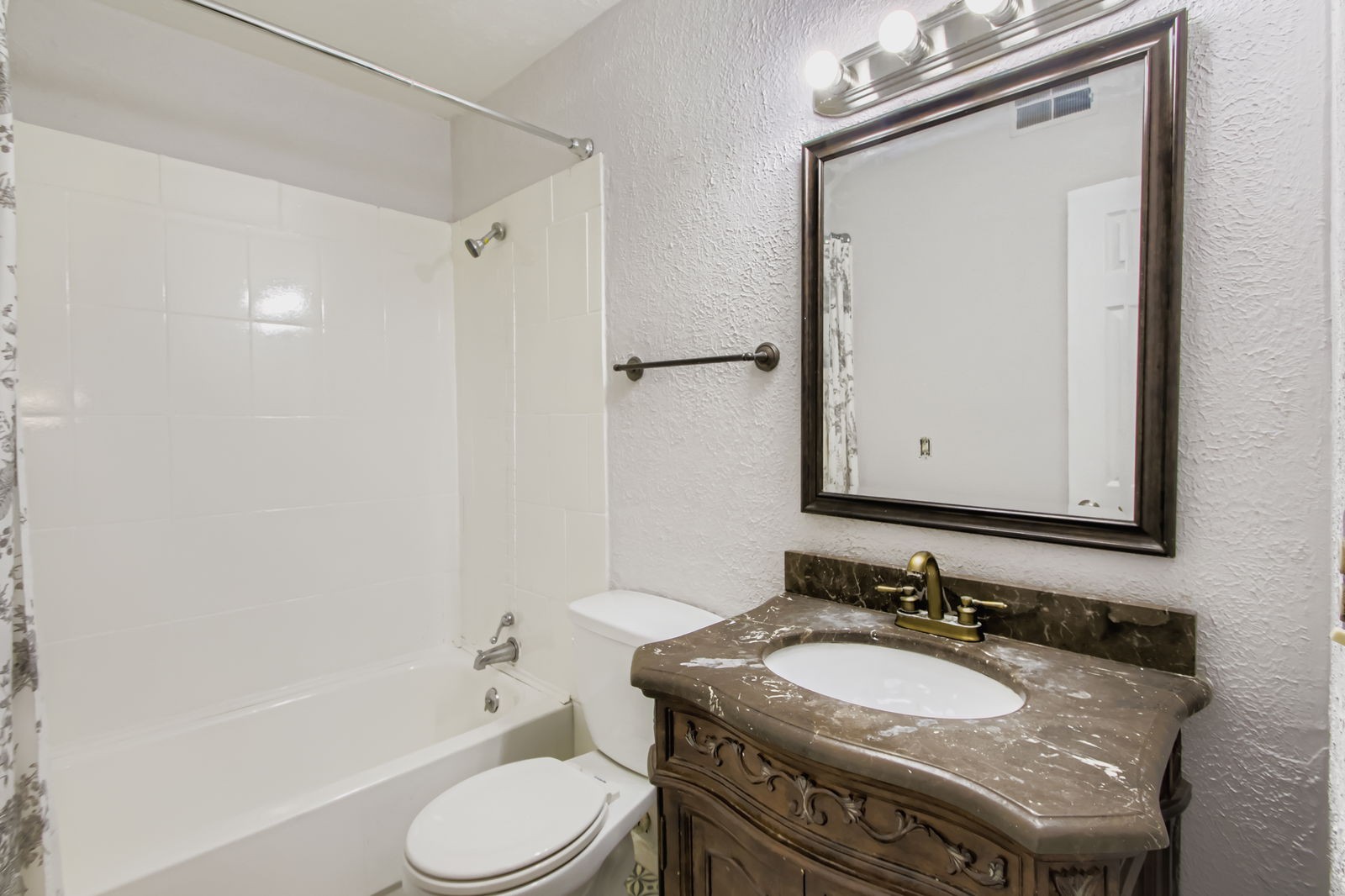 810 Bellevue Road, Unit 120 Nashville, TN 37221 - Photo 18 of 33 a bathroom with a granite countertop sink toilet a mirror and shower