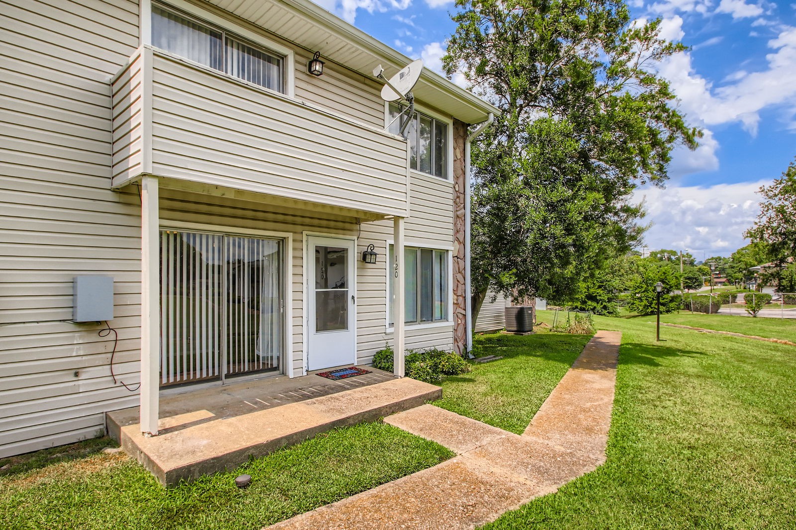 810 Bellevue Road, Unit 120 Nashville, TN 37221 - Photo 4 of 33 a front view of a house with a yard