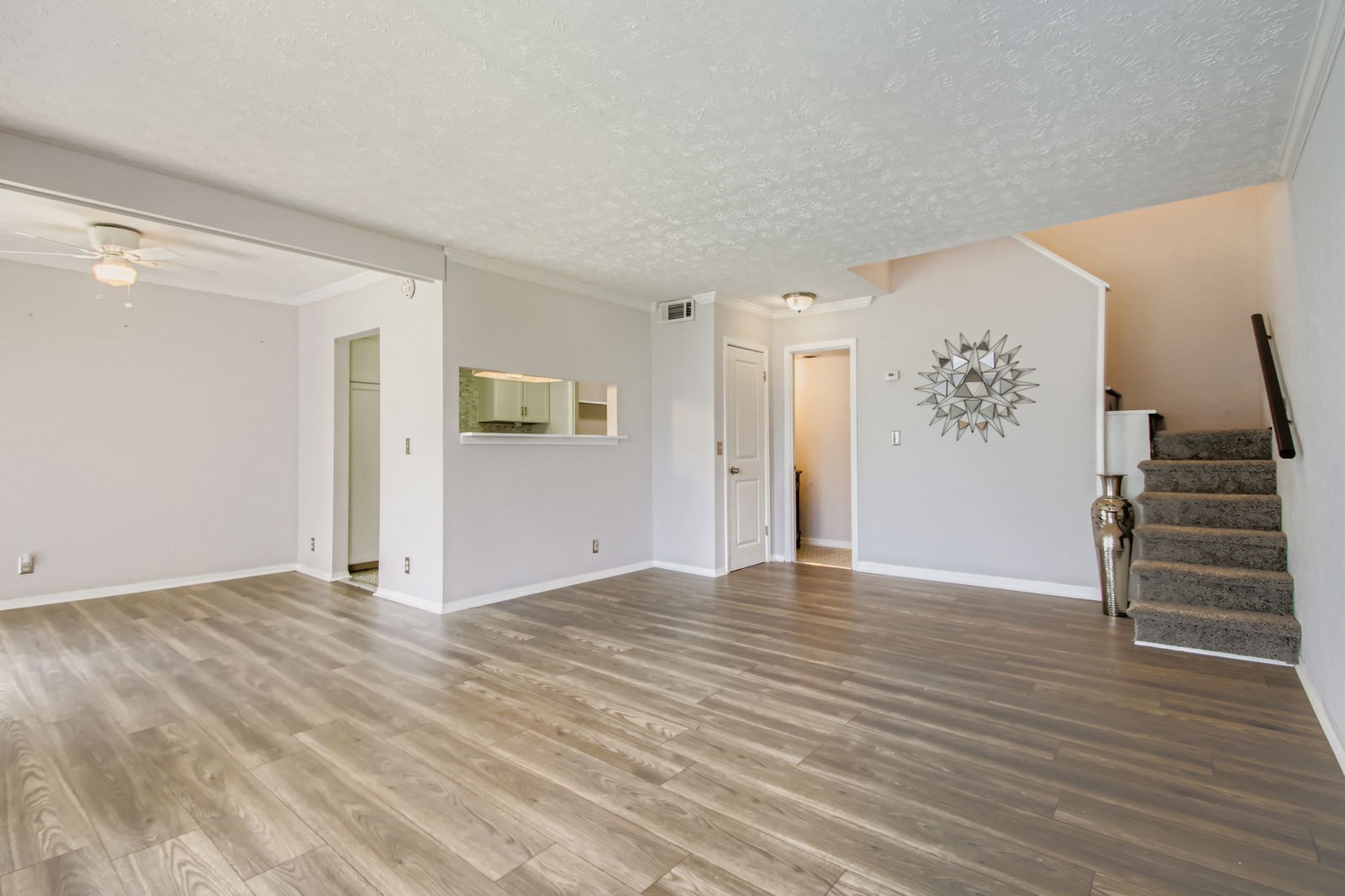 810 Bellevue Road, Unit 120 Nashville, TN 37221 - Photo 7 of 33 a view of an empty room with wooden floor and stairs