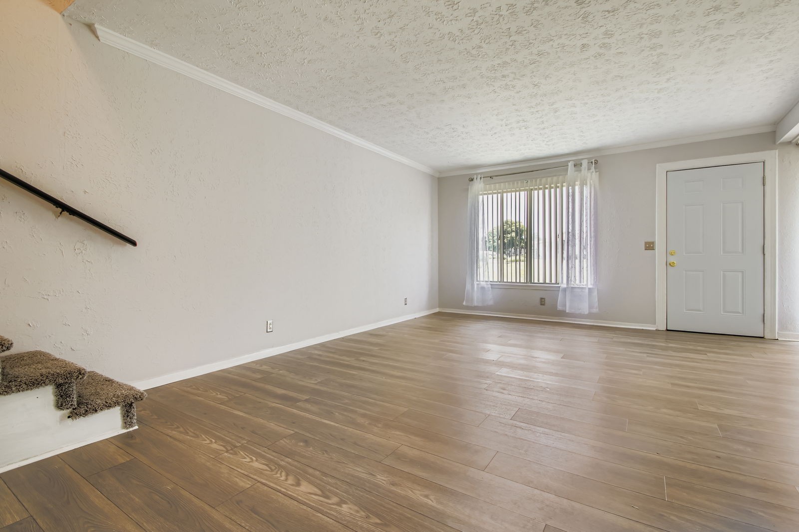810 Bellevue Road, Unit 120 Nashville, TN 37221 - Photo 8 of 33 an empty room with wooden floor and windows