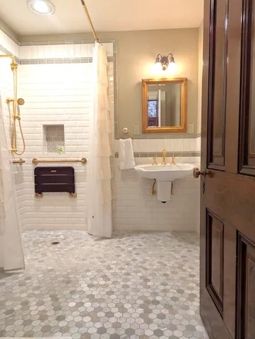 a bathroom with a sink a mirror and a bathtub