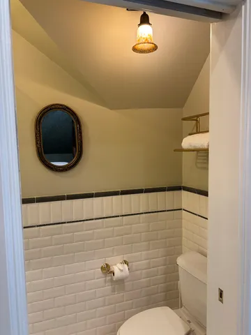 a bathroom with a toilet and a sink