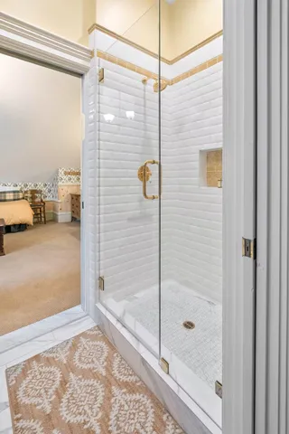 a bathroom with a shower and a bath tub