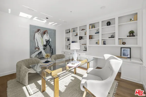 a work room with furniture and white walls