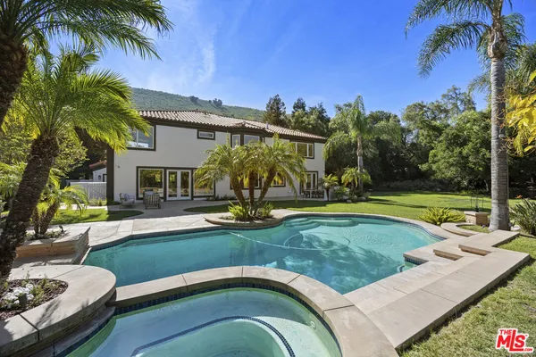 a view of a house with a swimming pool