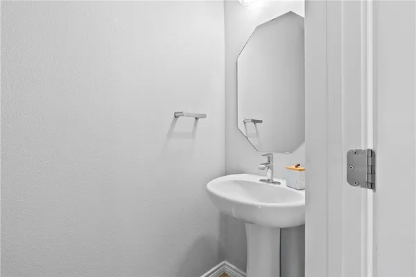 a bathroom with a sink and mirror