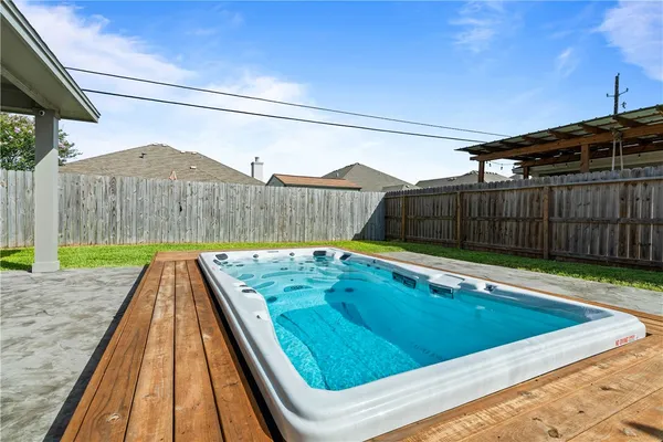 a view of a backyard with a small pool