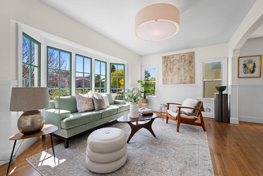 1220 Peralta Avenue Berkeley, CA 94706 - Photo 2 of 15 a living room with furniture and a large window