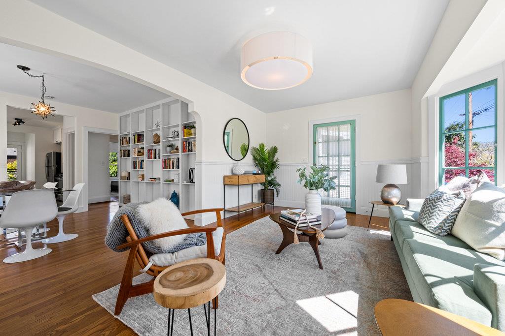 1220 Peralta Avenue Berkeley, CA 94706 - Photo 3 of 15 a living room with furniture a rug and a large window