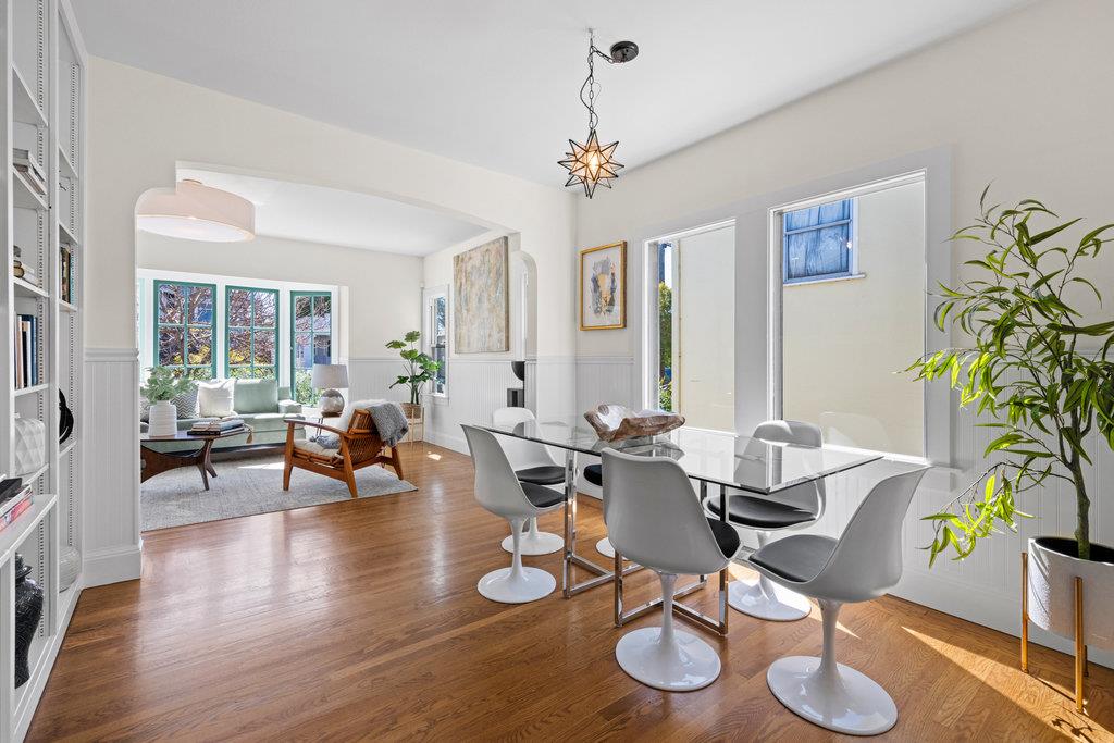 1220 Peralta Avenue Berkeley, CA 94706 - Photo 5 of 15 a view of a dining room with furniture window and wooden floor