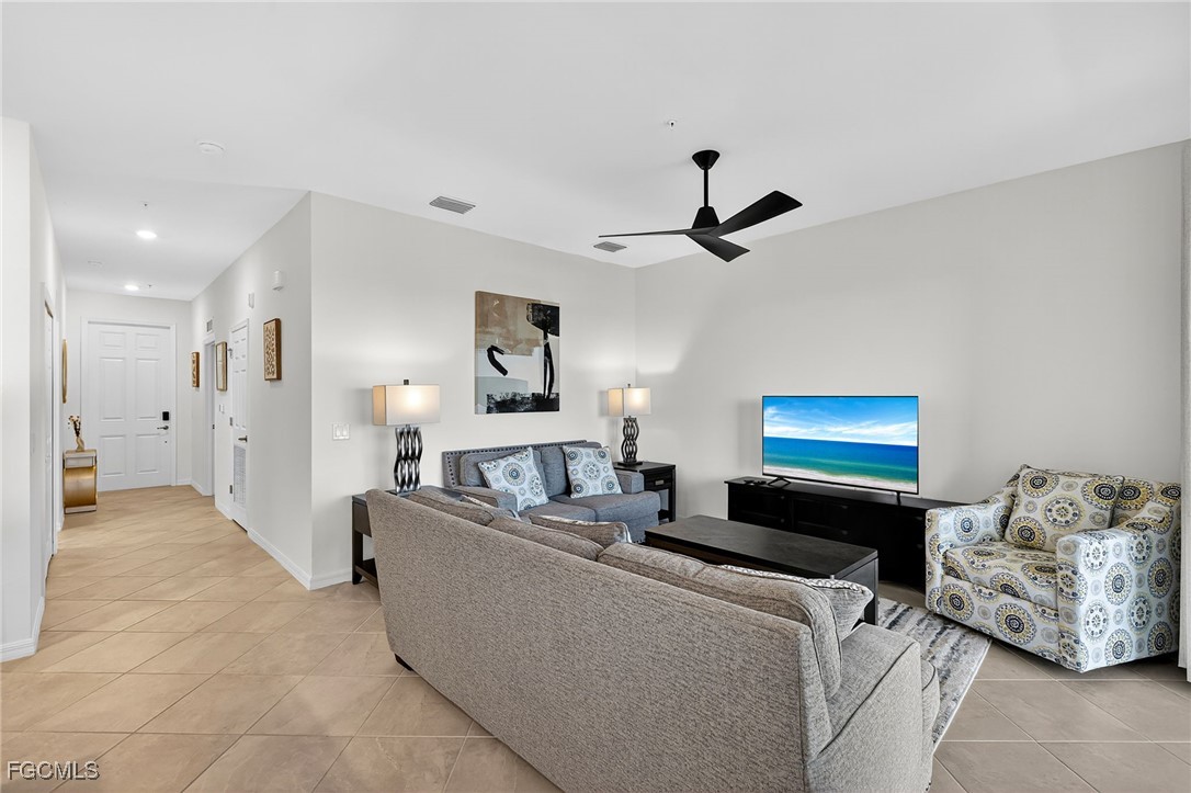 43997 Boardwalk Loop, Unit 1841 Punta Gorda, FL 33982 - Photo 12 of 43 a living room with furniture and a ceiling fan