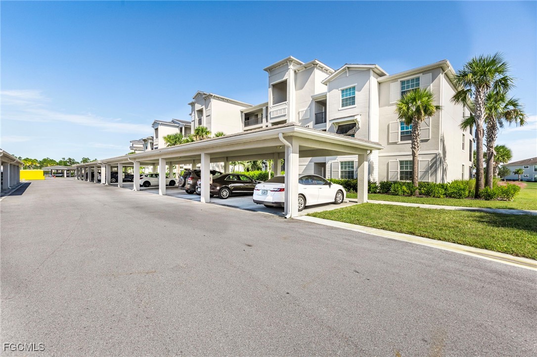 43997 Boardwalk Loop, Unit 1841 Punta Gorda, FL 33982 - Photo 2 of 43 a view of a building with a street