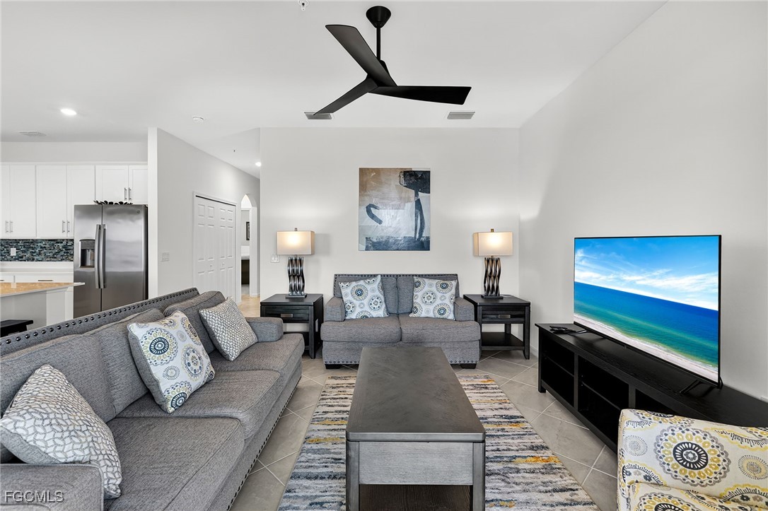 43997 Boardwalk Loop, Unit 1841 Punta Gorda, FL 33982 - Photo 21 of 43 a living room with furniture and a flat screen tv