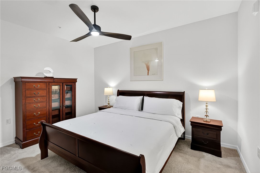 43997 Boardwalk Loop, Unit 1841 Punta Gorda, FL 33982 - Photo 23 of 43 a bedroom with a bed and a dresser