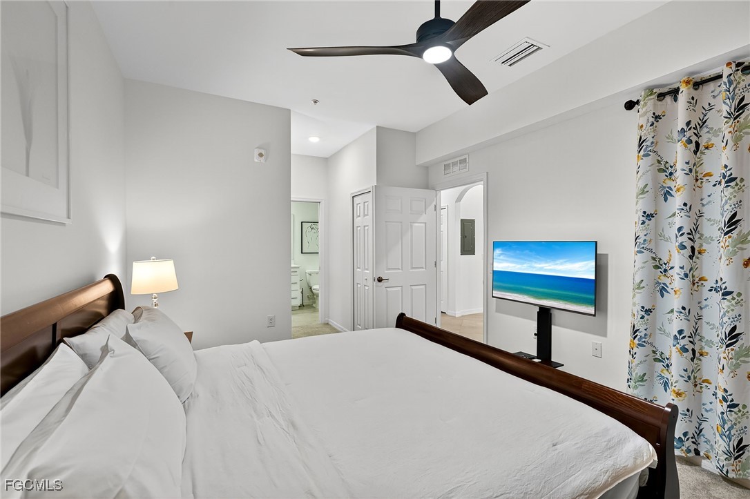 43997 Boardwalk Loop, Unit 1841 Punta Gorda, FL 33982 - Photo 25 of 43 a bedroom with a bed and a painting on the wall