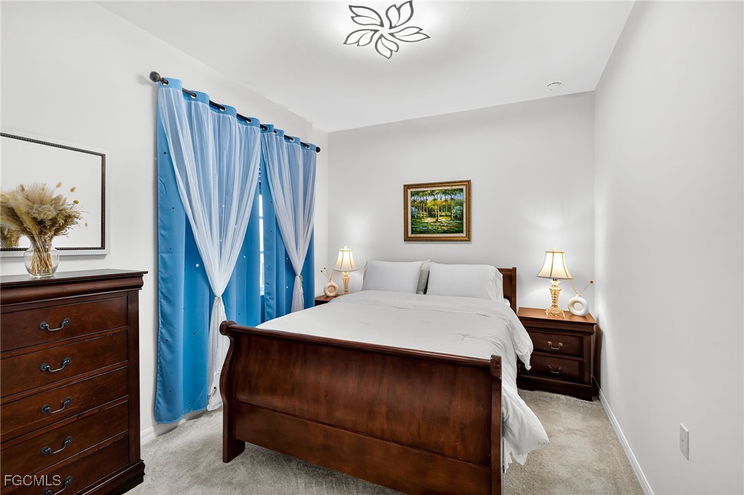 43997 Boardwalk Loop, Unit 1841 Punta Gorda, FL 33982 - Photo 29 of 43 a bedroom with a bed and a closet