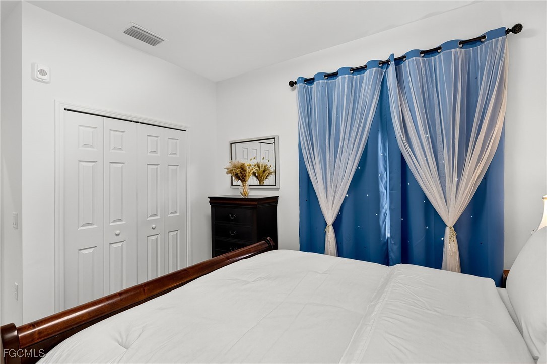 43997 Boardwalk Loop, Unit 1841 Punta Gorda, FL 33982 - Photo 30 of 43 a bedroom with a bed and a closet