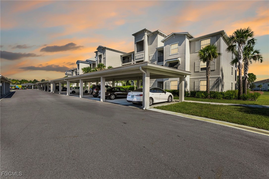 43997 Boardwalk Loop, Unit 1841 Punta Gorda, FL 33982 - Photo 3 of 43 a city street lined with buildings and trees