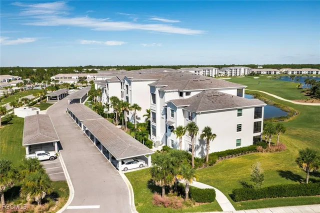 an aerial view of a house with a ocean view