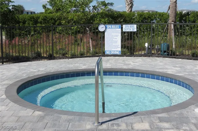 a view of a lake with a table and chairs