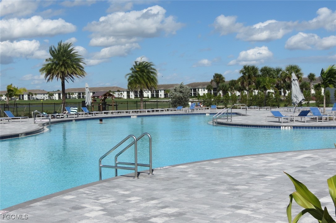 43997 Boardwalk Loop, Unit 1841 Punta Gorda, FL 33982 - Photo 42 of 43 a view of a lake with a table and chairs