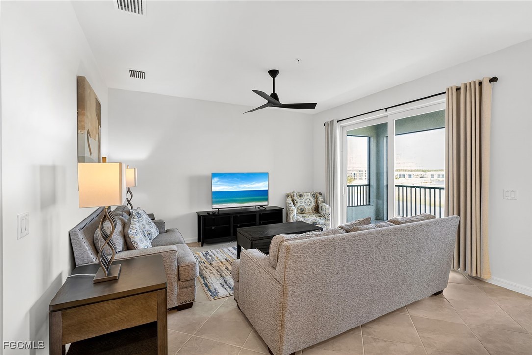 43997 Boardwalk Loop, Unit 1841 Punta Gorda, FL 33982 - Photo 10 of 43 a living room with furniture and a flat screen tv