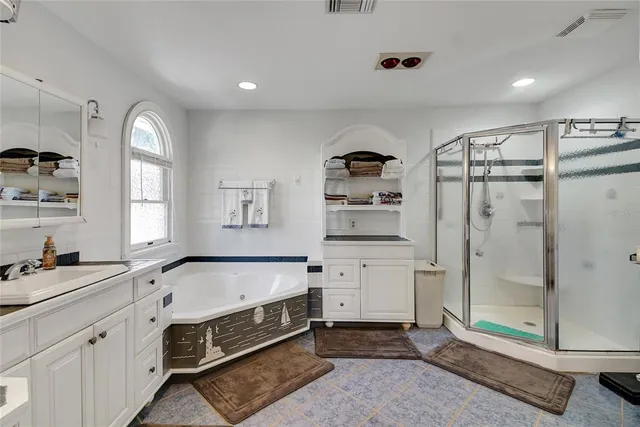 a bathroom with a toilet shower and a sink