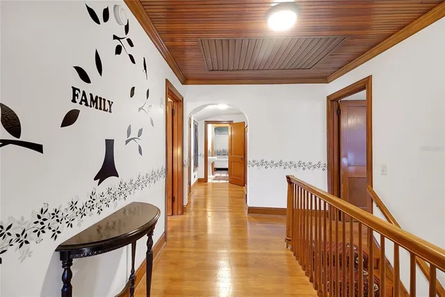 a living room with furniture a window and a chandelier
