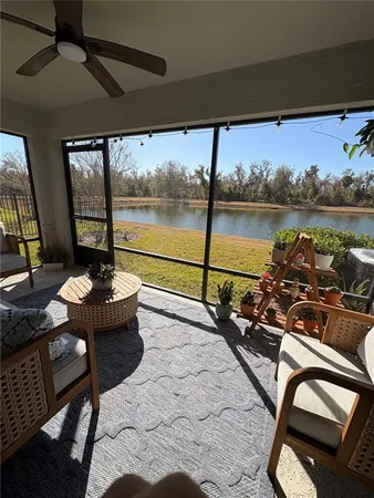 a view of a balcony with lake view and a potted plant