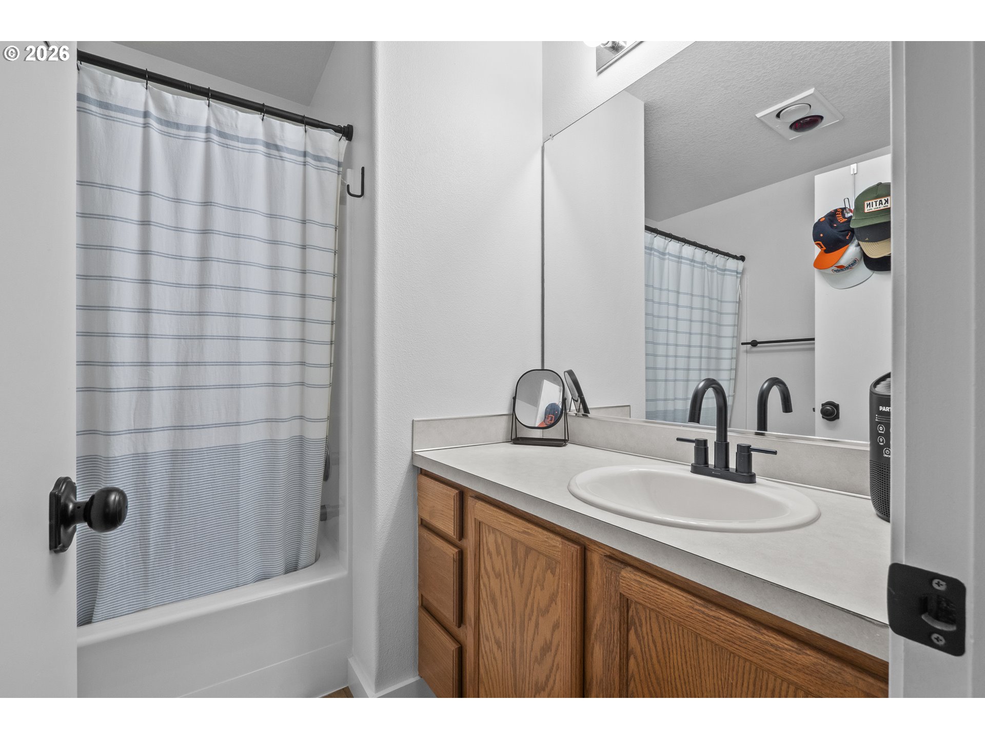 13949 Beavercreek Road, Unit 114 Oregon City, OR 97045 - Photo 11 of 27 a bathroom with a sink and a mirror