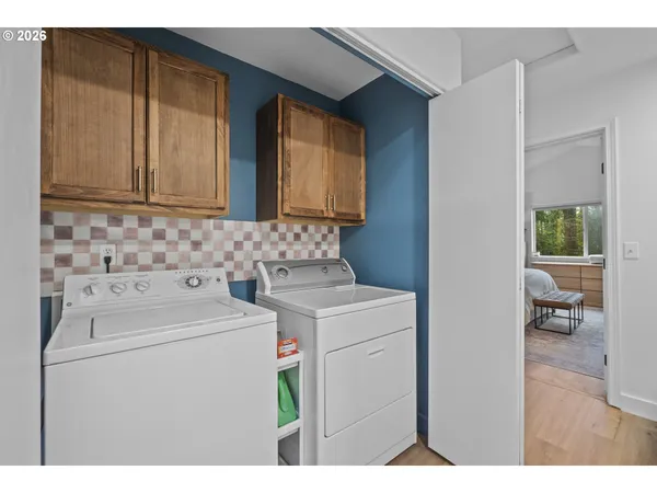 a utility room with dryer and washer