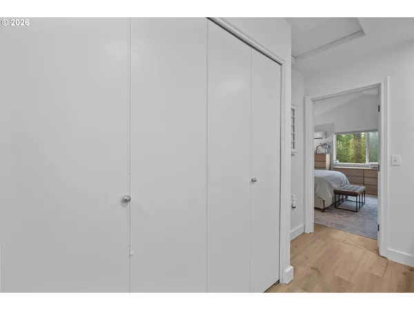 a living room with a couch and a view of bedroom