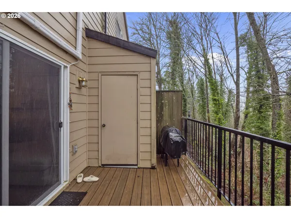 a view of balcony with wooden floor